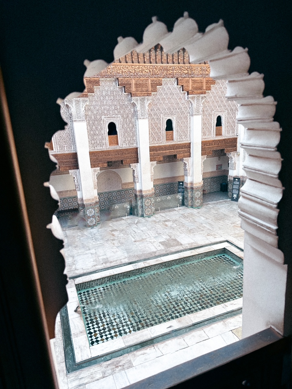 Window looking into the courtyard of Ben Youssef Madrassa